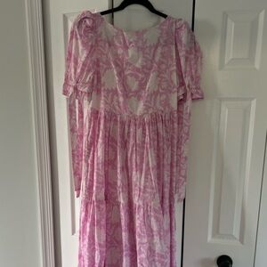 The Gigi is a dress to impress with its alluring oval cut out and bow